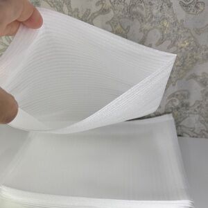 20 White foam pockets for packaging fragile items.